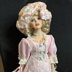 The Heritage Signature Collection: Elegant Pink Porcelain Doll with Lace Dress